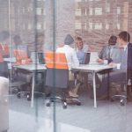 businesspeople laughing during a meeting