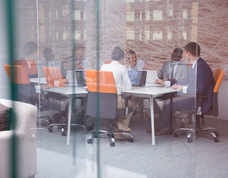 businesspeople laughing during a meeting