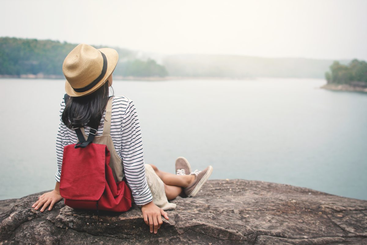 Woman enjoying the view of a lake