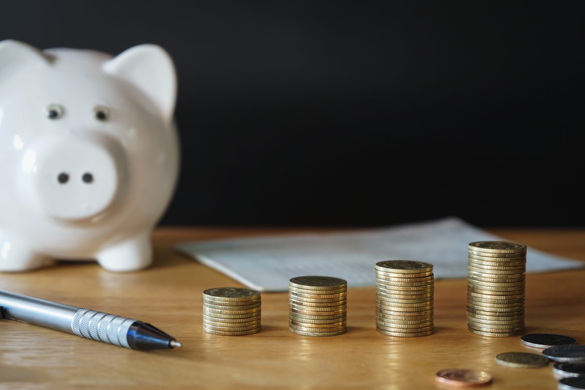 Piggy bank and stacks of coins