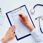 Filling out open enrollment paperwork