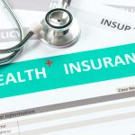 Health insurance form with stethoscope