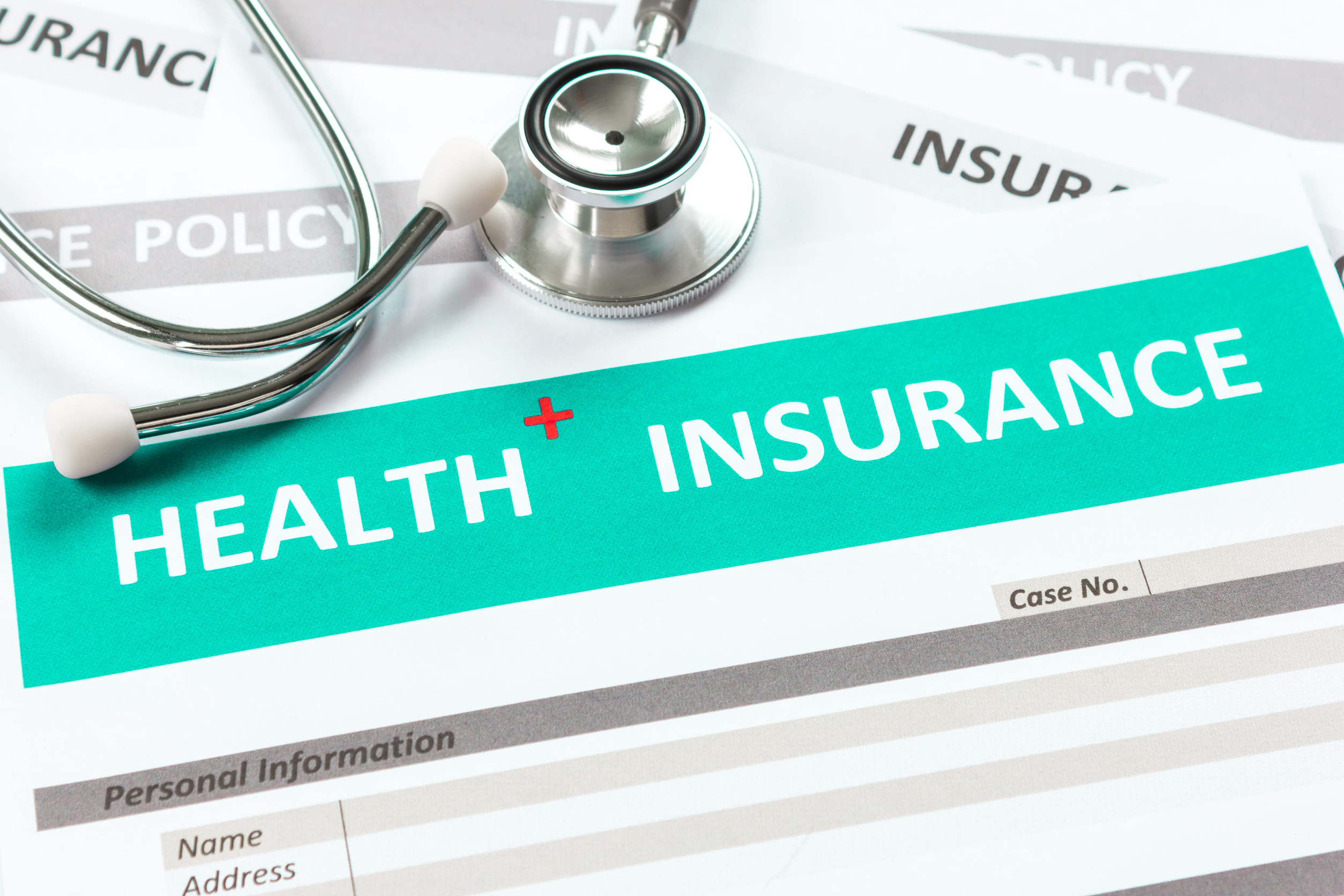 Health insurance form with stethoscope